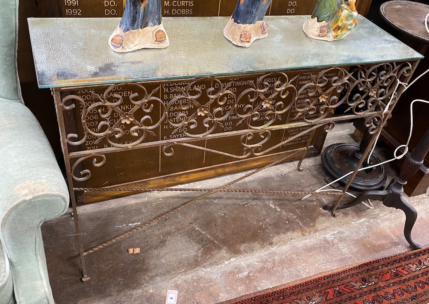 A wrought iron glass top console table, width 109cm, depth 32cm, height 77cm